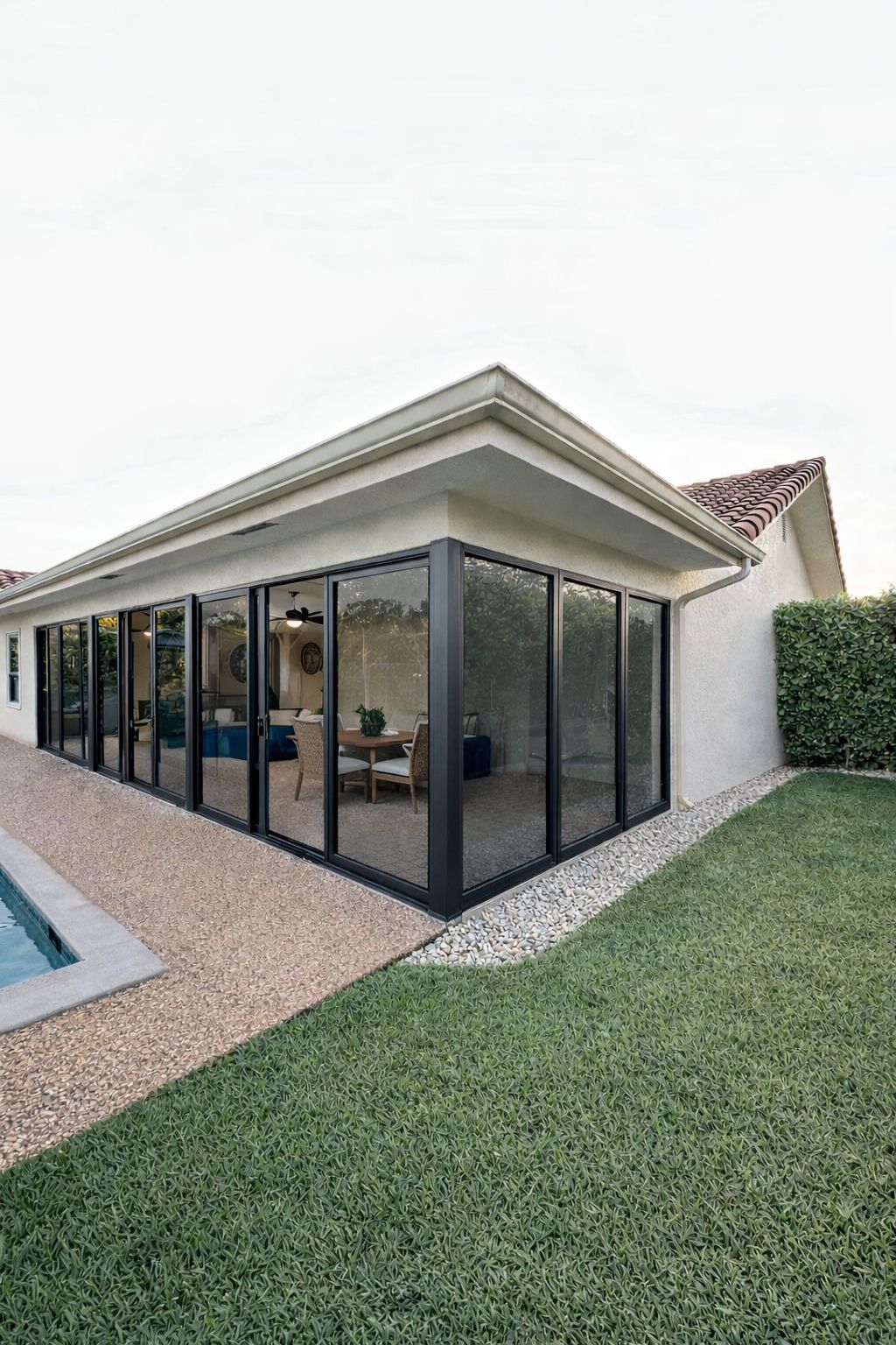 Impact sliding glass door enclosure installed in Coral Springs Florida by East Blue Windows & Doors.